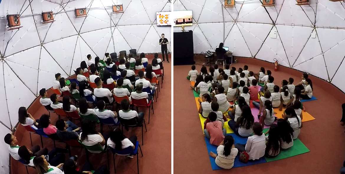 Alunos em uma palestra dentro da geodésica